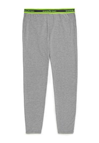 Grijze leggings met een elastische tailleband en een contrasterend groen en zwart logo. De stof lijkt zacht en rekbaar, geschikt voor comfort.