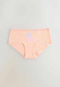 Culotte pour femme de couleur pêche douce, avec deux petites impressions florales, une lavande et une rose, centrées sur la ceinture avant.