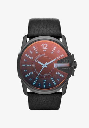 Black leather-strap wristwatch with large round dial, orange gradient face, white hour and minute hands, blue hour markers, and date display at 3 o'clock.