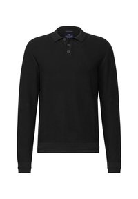 Schwarzes Baumwoll-Poloshirt mit langen Ärmeln, einem strukturierten Stoff, einer Knopfleiste mit drei Knöpfen sowie gerippten Bündchen und Saum.