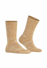 Skarpety dziane z miękkiej, teksturowanej tkaniny w ciepłym żółtym i białym wzorze, z prążkowanymi ściągaczami i średniej wysokości krojem.
