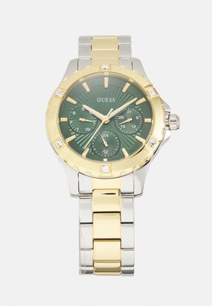 Montre en or et argent avec un cadran texturé vert, dotée de trois sous-cadrans, d'accents dorés et de marqueurs en cristal sur un bracelet en maillons métalliques.