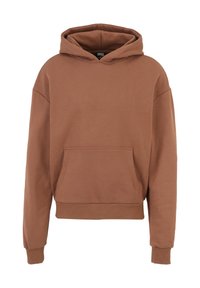 Brun hoooded sweatshirt tillverkad av mjukt tyg. Har en framficka och ribbade ärmslut. Oversized passform med sänkta axlar och croppad längd.