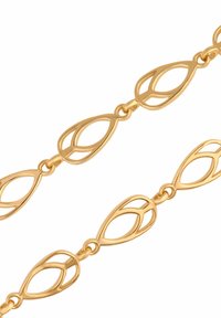 Złocony metalowy łańcuszek, składający się z połączonych owalnych kształtów z otwartymi detalami. Gładka powierzchnia z polerowanym wykończeniem i jednolitą kolorystyką.