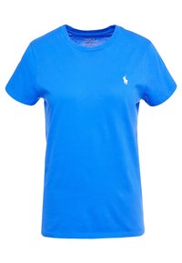 Modré bavlněné tričko s kulatým výstřihem a krátkými rukávy. Na levé straně hrudi je malý bílý logo. Měkká textura a běžný střih.