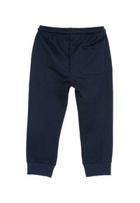 Pantalons de survêtement en coton bleu marine avec une taille élastique, des poignets ajustés et une poche arrière unique. Texture douce, design simple.
