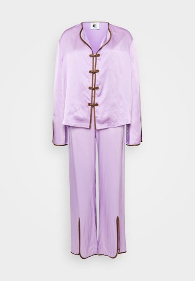 Lavender silk loungewear set featuring a long-sleeve jacket with brown trim and toggle closures, paired with matching wide-leg pants.