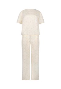 Cream-colored short-sleeve top and matching long pants set with subtle small brown scattered print on a white background.