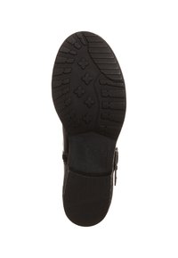 Suela de zapato de goma negra con patrón de textura para tracción, que incluye formas redondeadas y angulares. Presenta un ligero tacón y un logo en relieve.