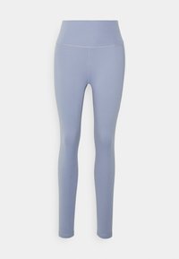 Leggings azzurri chiari con un'alta vita, realizzati in tessuto elasticizzato. Presentano cuciture piatte e una finitura liscia e opaca. Senza motivi né dettagli.
