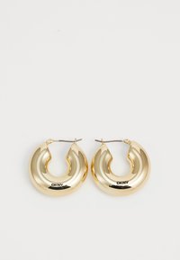 Pendientes de aro de oro con un diseño liso y redondeado y un acabado brillante, que cuentan con un cierre para asegurar. Grabados con "DKNY".