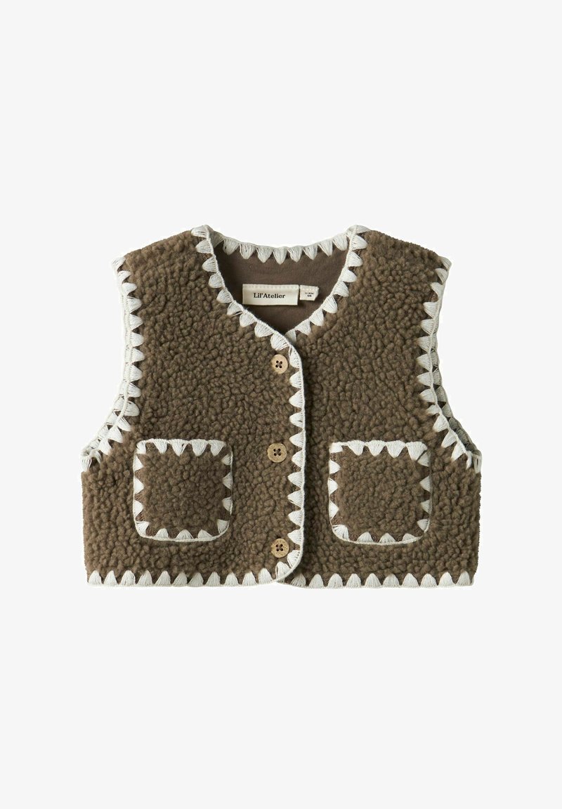 Pruun tekstuuriga fliisvest valgete siksakääristega, kahe eesmise tasku ja kolme keskel oleva puitnööbiga.