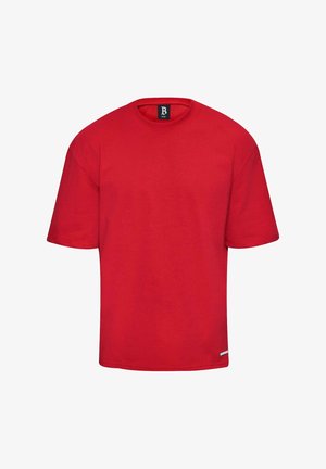 T-shirt in cotone rosso con scollo rotondo e maniche corte. Presenta una linea dritta e un piccolo etichetta all'orlo. Design semplice e in tinta unita.