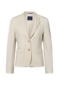 Blazer a righe beige realizzato in tessuto tessuto, con colletto a punta, chiusura a due bottoni e due tasche anteriori. Foderato con un interno a motivi.
