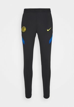 Schwarze Slim-Fit-Sporthose mit blauen Seitenakzenten, gelbem Nike-Swoosh am rechten Oberschenkel und gelbem Inter-Mailand-Logo am linken Oberschenkel.