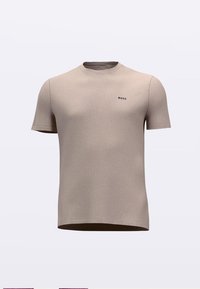 Rövid ujjú bézs póló puha, texturált anyagból. Finom fekete logó található a mellrészen, klasszikus környakú kivitelben.