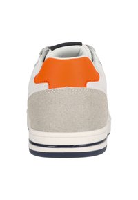 White sneaker with grey and orange accents. Features a suede heel, smooth leather upper, and rubber sole with a striped design.