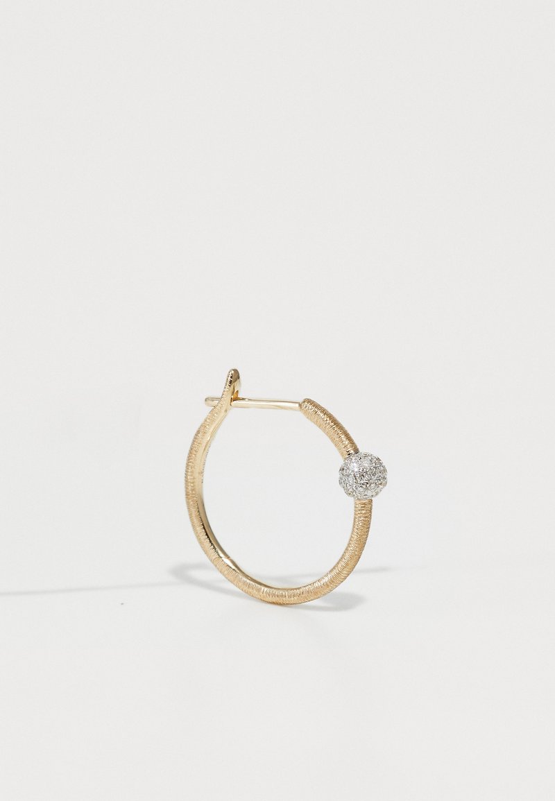 Gold hoop earring with a textured finish and a pave-set silver ball accent. Circular shape with a secure clasp, featuring a lustrous surface.