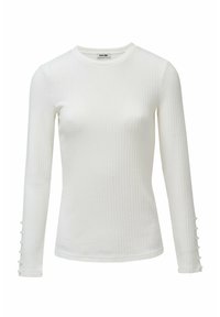 Witte langermige top met ribbelstructuur, ronde halslijn en knoopaccenten op de mouwen. Gemaakt van een zachte, rekbare stof.