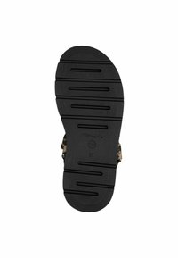 Svart gummisåle til sandaler med horisontale spor for trekkraft. Mønstertrykk synlig på den øvre delen nær sidespenne. Størrelse merket som 37.