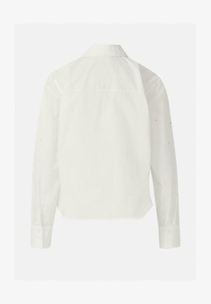 Vue arrière d'une chemise blanche à manches longues avec col et poignets boutonnés, présentant une coupe légèrement ample et un minimum de détails.