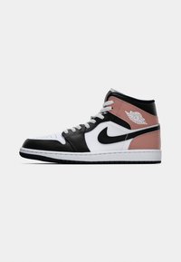 High-top Air Jordan sneaker in black, white, and dusty pink with Nike swoosh and Air Jordan wings logo on the side.