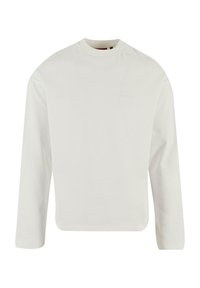 Weißes Langarm-T-Shirt aus Baumwolle. Rundhalsausschnitt und lockere Passform mit einem dezent geprägten Logo auf der Vorderseite. Glatte Textur.