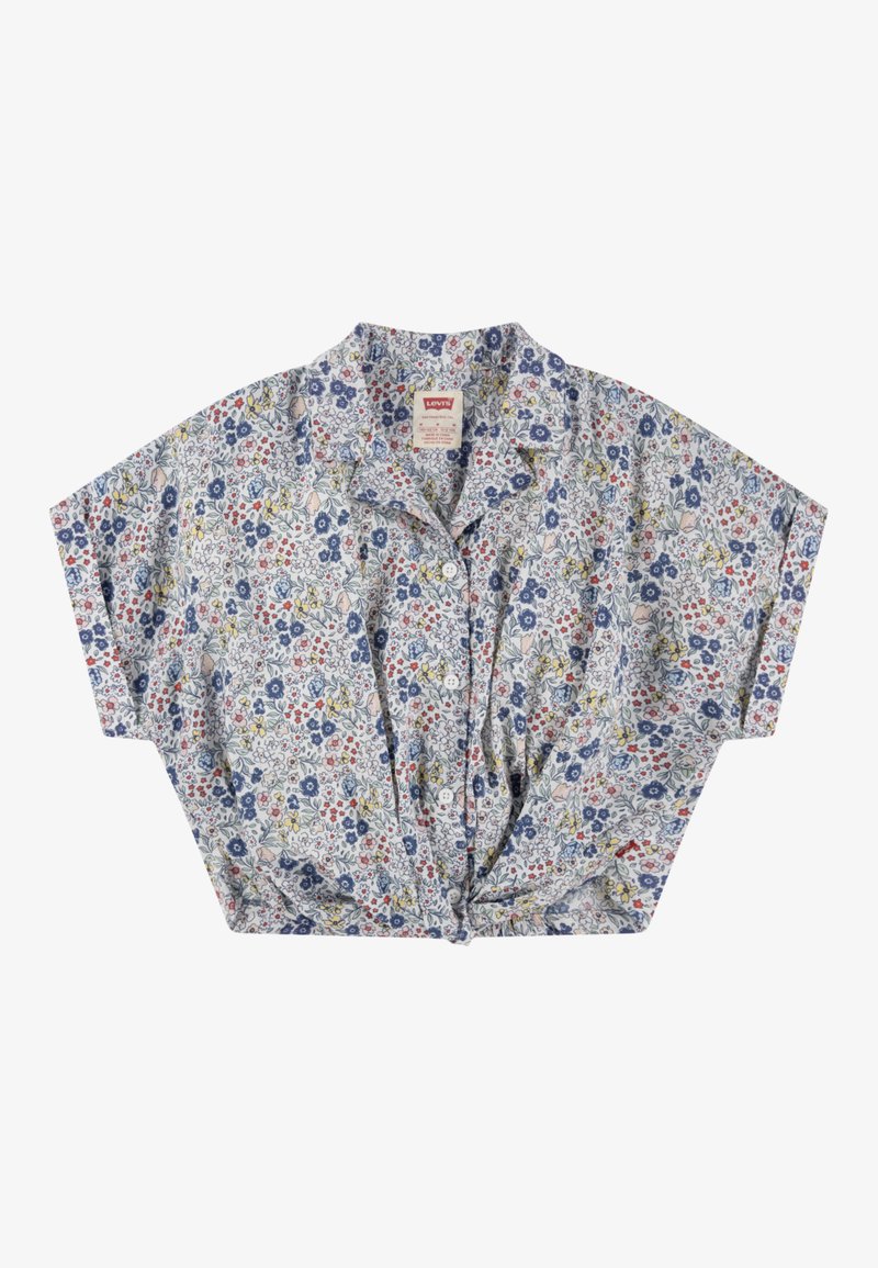 Floral short-sleeve shirt with a knotted front, featuring a light blue background, pink, red, and navy flowers, and a relaxed fit.