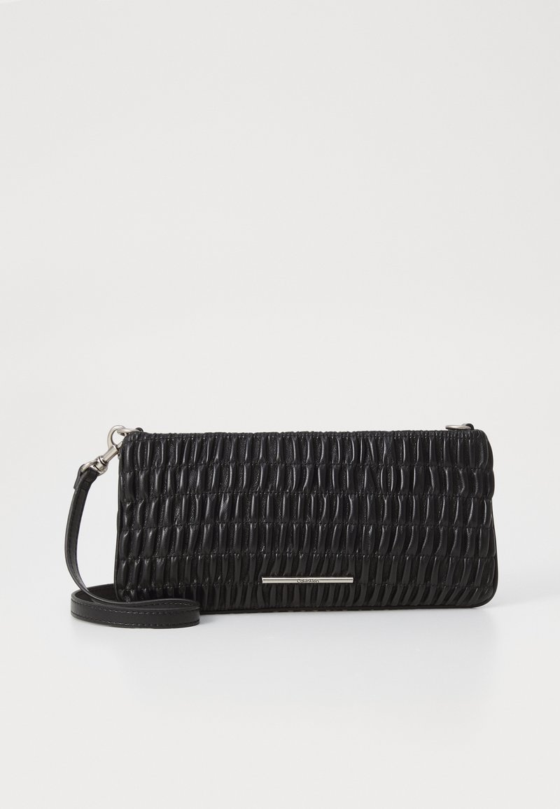 Black clutch bag made of textured leather with a gathered design, featuring a detachable strap and a metallic accent bar on the front.