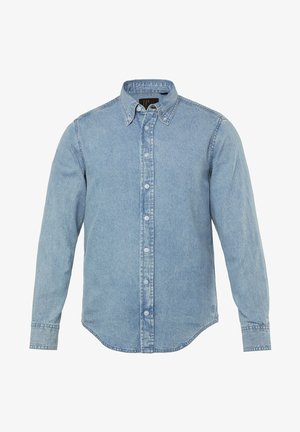 Světle modrá džínsová košile s dlouhými rukávy, zapínáním na knoflíky, špičatým límcem a zakřiveným lemem. Vyrobena z texturované džínsoviny.