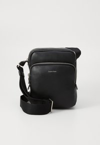 RAISED LOGO - Cross body bag - black
