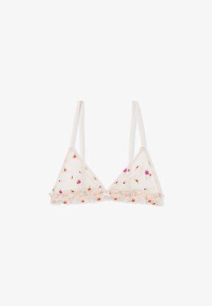 Sheer beige bralette with adjustable straps, small floral embroidery in pink and orange, and ruffled trim along the bottom edge.