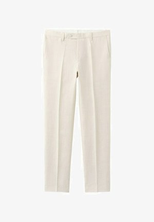 Beżowe spodnie o dopasowanym kroju z szlufkami na pasek i przednimi kieszeniami, zapinane na guzik i zamek błyskawiczny.