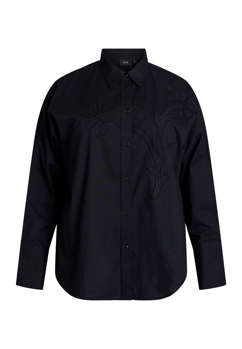 Zwarte lange mouwen shirt met een geborduurd bloemenontwerp op de voorkant. Gemaakt van katoen met een knoopsluiting kraag en een gebogen zoom.