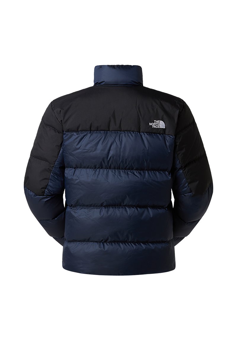 Dunkelblau und schwarze Steppjacke mit hohem Kragen, gestepptem Design und kleinem Logo auf der linken Schulter.