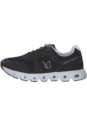 Black athletic shoes with mesh upper, white accents, and hexagonal outsole. Features a lace-up design and logo on the side.