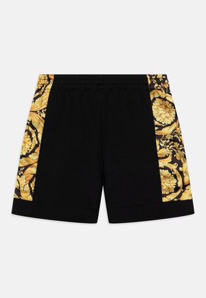 Zwarte shorts met een gele bloemenpatroon aan de zijkanten, elastische tailleband en een gladde katoentextuur. Accenten omvatten sierlijke ontwerpen langs de randen.