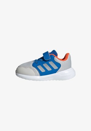 Blue and grey athletic shoe with mesh upper, hook-and-loop strap, flat rubber sole, and decorative grey stripes on the side.