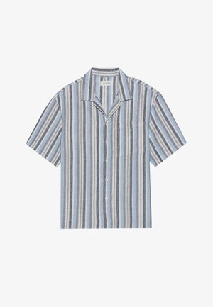 Īsām piedurknēm krekls ar ziliem, tumši ziliem un baltiem vertikāliem svītrām, ar apkakli, priekšējo kabatu un pogu aizdari. Strukturēta auduma.