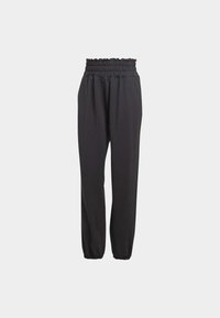 Pantalon noir taille haute avec taille et poignets élastiqués froncés, offrant une coupe décontractée et droite.
