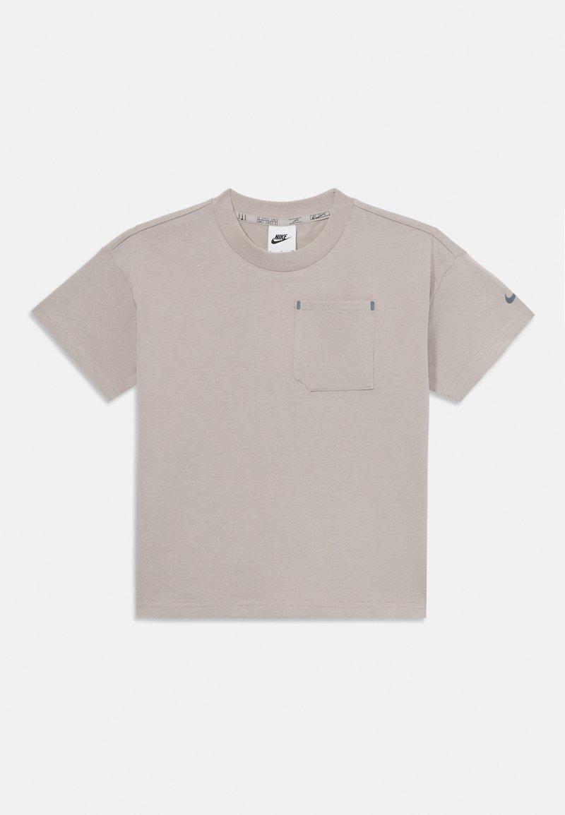 Light gray T-shirt with round neckline, short sleeves, a left chest pocket, and a small Nike logo on the sleeve. Cotton material, casual design.