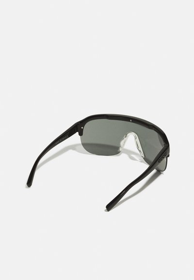 Black sunglasses with a sleek design, gray tinted lenses, and thin black arms. Features a clear bridge and minimalistic hardware accents.
