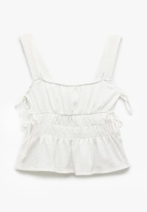 Hvid ærmeløs top med en tekstureret stof, der har justerbare bånd i siderne og en samlet, udvidet kant.