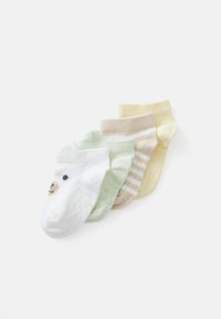 Vijf paar peutersokken: wit met berengezicht, mintgroen, beige met strepen en lichtgeel, met verschillende texturen en patronen.