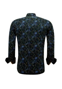 Langarmshirt in donkerblauw met een sleutelpatroon in goud. Heeft een klassieke kraag en omgeslagen manchetten. Gladde stoftextuur.