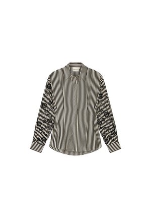 Zwart-wit gestreepte lange mouwen shirt met een effen gestreept patroon aan de voorkant en geborduurde details op de mouwen.
