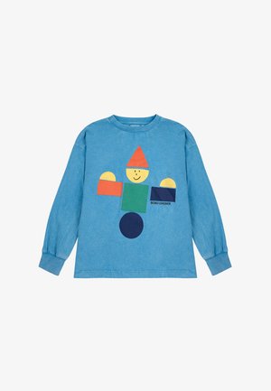 Camicia a maniche lunghe di colore azzurro chiaro con un design geometrico colorato di un personaggio con un volto sorridente. Realizzata in cotone con una texture morbida.