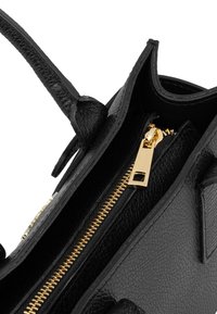 Black leather handbag with a textured finish, featuring a gold zipper and hardware. Open top design with interior compartments visible.