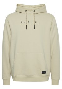 Beige hætte sweatshirt med sort "A.R.C." skrift, justerbare snore, en kengurulomme og et lille mærke nederst.