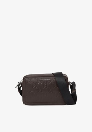 Brown faux leather crossbody bag with embossed geometric pattern, features a zip closure, silver hardware, and an adjustable strap.